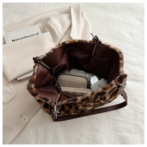 Interior view of leopard print plush tote bag showing large capacity and inner pockets