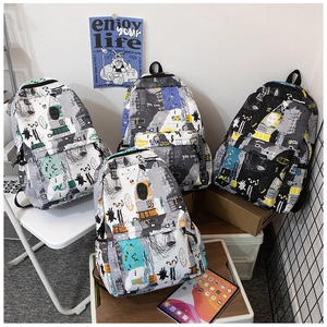 Detail showing graffiti pattern backpacks in four colors including black and grey
