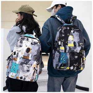 Close-up of graffiti print backpacks in black and white with side pockets for students