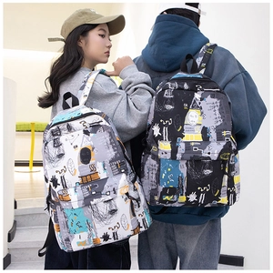 Lifestyle shot showing the street style graffiti backpack worn by models on stairs
