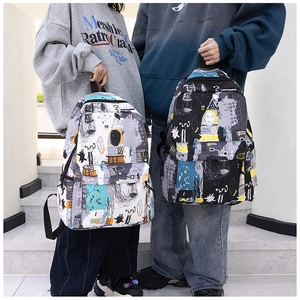 Detail of graffiti canvas backpack featuring abstract hand-drawn prints and multi-pockets