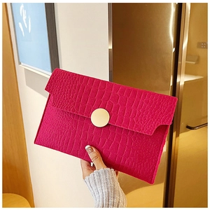 Fuchsia crocodile embossed leather envelope clutch bag with large round gold buckle
