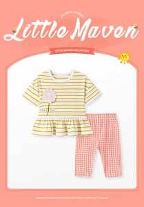 Detail of girls summer cotton set with yellow striped top and pink plaid pants