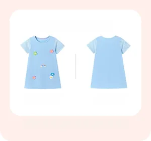 Flat lay of light blue short sleeve cotton girl dress with rainbow flower embroidery