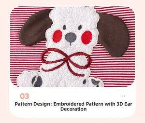 Detailansicht eines Hunde-Applikationsmusters mit 3D-Ohren auf einem rot gestreiften Kleid