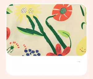 Detail of sunflower and floral water print pattern on soft baby girl cotton fabric