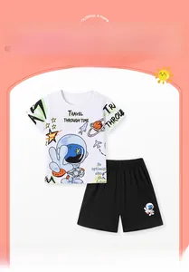 Detail of boys' summer set with astronaut print t-shirt and casual black shorts