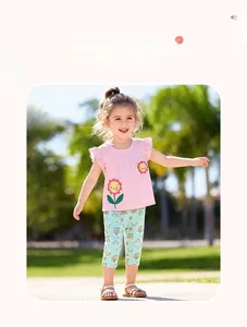 Detail of girls pink sunflower embroidered tee and rainbow print pants set