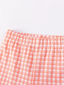 Girls orange and white checkered cotton trousers with comfortable elastic waistband