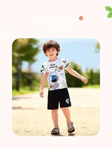 Close-up of boys white cotton t-shirt with astronaut print and black shorts set