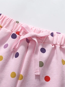 Short rose pour fillettes à pois colorés et taille élastique avec un joli noeud