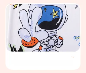 Detail of cartoon astronaut print on white boy's t-shirt using water printing technique