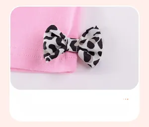 Close-up of pink knit fabric featuring a 3D leopard print bow decoration for girls