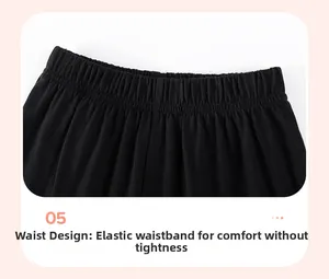 Close-up of boys' black summer shorts featuring a comfortable wide elastic waistband detail