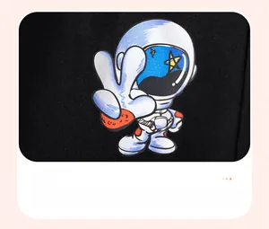 Detailed view of printed astronaut graphic and high-quality knit cotton on boys' t-shirt