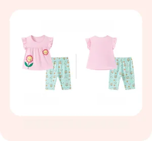 Flat lay of pink cotton ruffle sleeve top and mint rainbow pants, front and back view