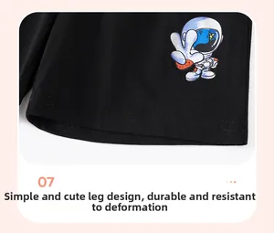 Detail of boys knit cotton shorts hem with double stitching and astronaut print