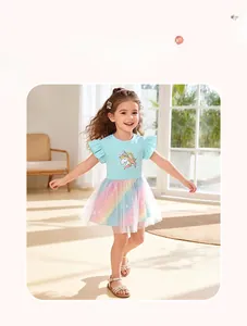 Close-up of girls' dress showing mesh rainbow skirt and cute unicorn print on light blue top