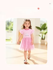 Detail of pink girls' tutu dress featuring ruffled sleeves and cute bunny patterns