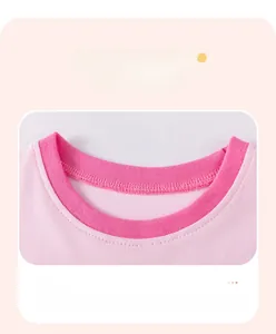 Detail of pink cotton dress neckline with dark pink contrast ribbed collar and neat stitching