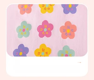 Close-up of light purple knit fabric with colorful floral heat transfer print detail
