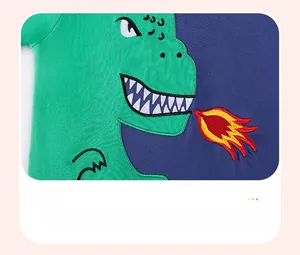 Detail of cotton kids t-shirt showing high-quality dinosaur embroidery and stitching