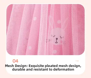Detail of pink double-layer mesh skirt with white polka dots and cartoon rabbit prints