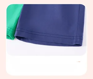 Detailed close-up of double-needle stitched hem on cotton knit boys' shorts set