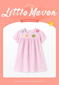 Close-up of pink girls dress showing round neckline and colorful knitted flower details