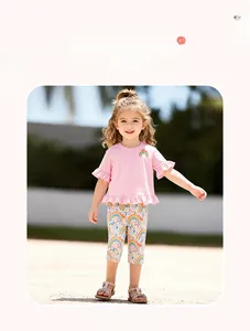 Detail of pink t-shirt with rainbow embroidery and matching printed leggings set