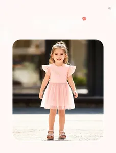 Pink girl's tulle dress detail with ruffled sleeves and gold bow pattern print