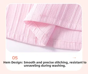 Detail view of pink cotton dress hem showing fine stitching and durable wave texture