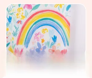 Close-up of vibrant rainbow and floral print fabric on girls summer two-piece set