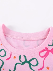 Robe rose en maille pour fille avec nœud vert et motifs d'étoiles orange imprimés