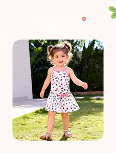 Detail of toddler girl summer dress with colorful heart print and pink bow decoration