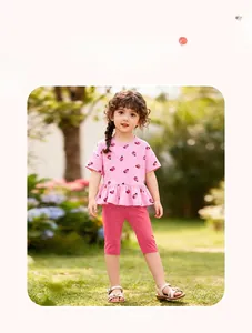 Ensemble fille avec t-shirt rose imprimé coccinelle à volants et leggings rose fuchsia