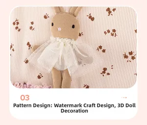 Detail of pink ribbed fabric dress featuring floral prints and a 3D plush rabbit motif