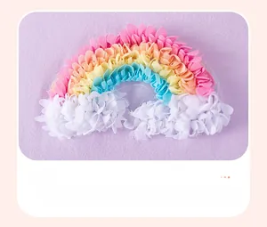Detailed close-up of a 3D rainbow appliqué on a soft purple cotton girls' t-shirt