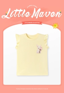 Close-up of yellow cotton t-shirt with ruffles and a colorful bunny floral print