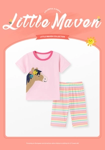 Detail of girls' cotton summer set with horse embroidery and striped shorts