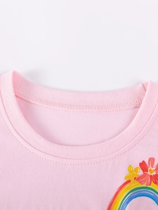 Pink cotton girls' t-shirt featuring rainbow and floral prints with round neckline