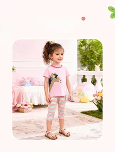 Detail of girls summer set with pink pony embroidery top and rainbow striped pants