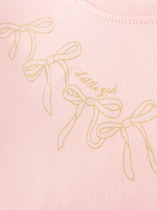 Pink cotton knit dress for girls featuring a golden bow print and round neckline