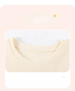 Close-up of the ribbed neckline on this breathable light beige cotton t-shirt for girls
