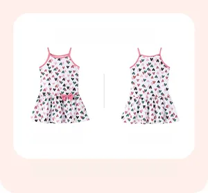 Front and back detail of girls cotton sundress featuring colorful heart prints and pink bows