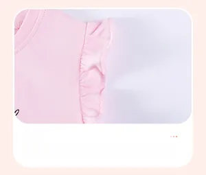 Detail of ruffled sleeve cuff with pleated layers on a pink cotton girls' t-shirt