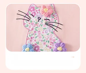 Detail of pink cotton tee with floral cat applique and 3D crochet flower embroidery