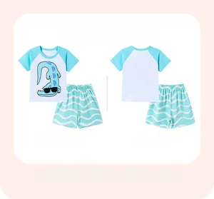 Front and back detail of boy's cotton summer set with cartoon crocodile print