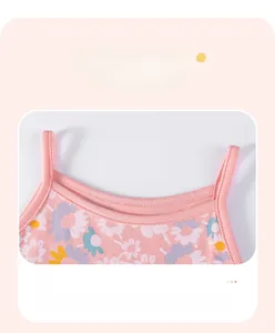 Detail of pink floral toddler dress straps with high-quality daisy print and stitching