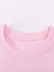 Pink cotton knit t-shirt for girls featuring a ribbed round neck and reinforced stitching